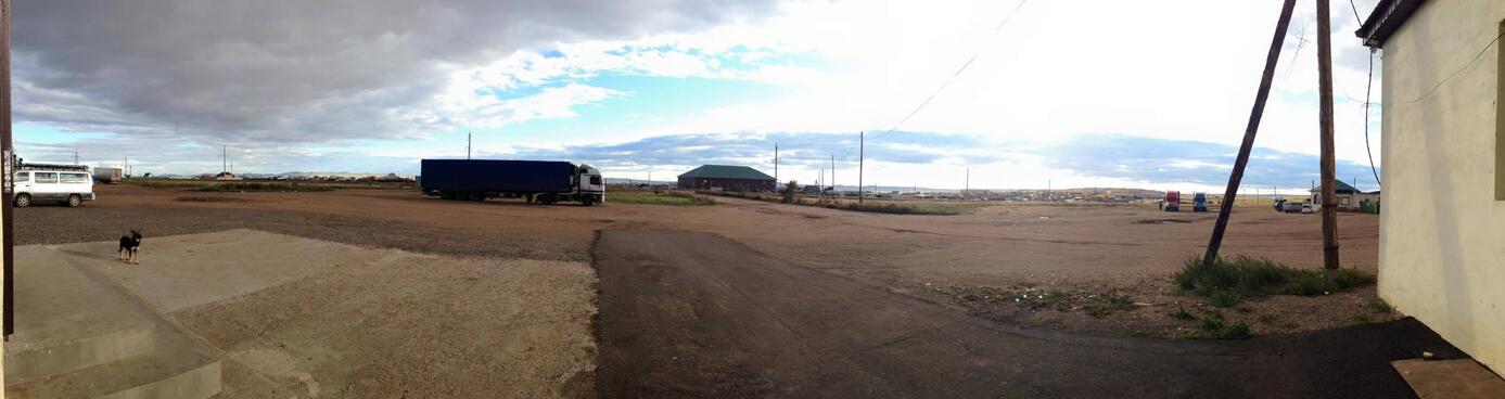 A truck, a dog, and not much else, at a truckstop in Zabaikalsk.