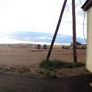 A truck, a dog, and not much else, at a truckstop in Zabaikalsk.