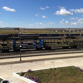 Empty railway wagons wait patiently in the hot midday sun at Zabaikalsk.