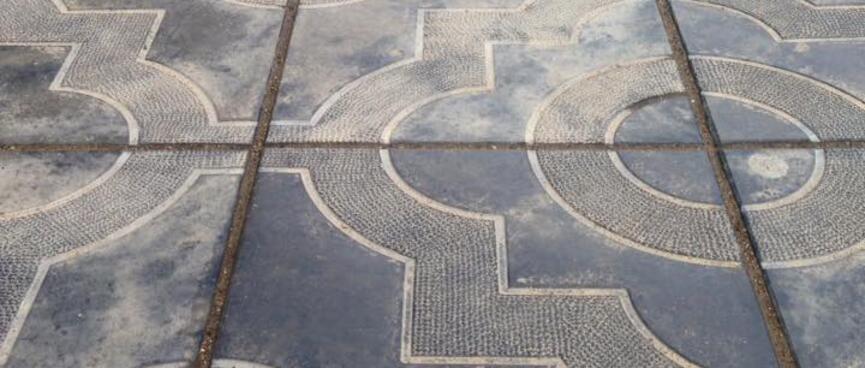 Squares and circles form ornate patterns on the footpath, in Chita.