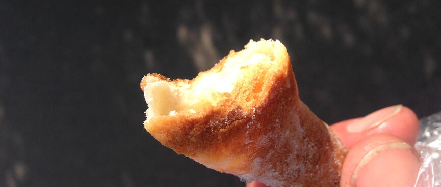 The crispy end of a chewy bread snack.