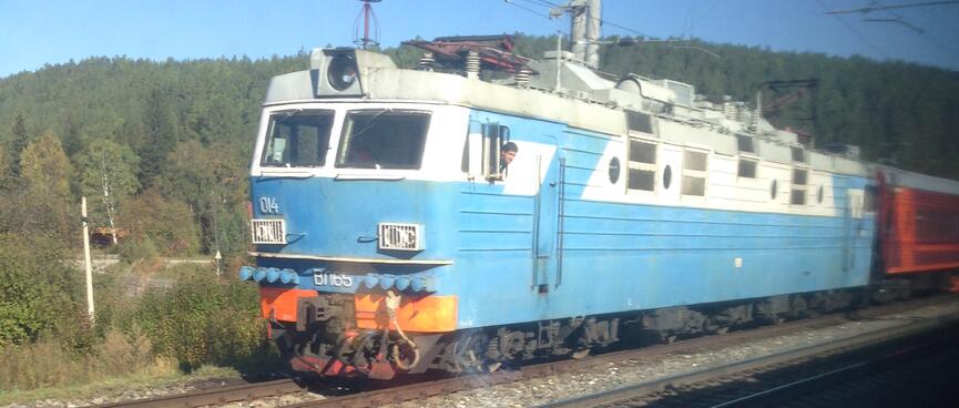 A pale blue electric locomotive.