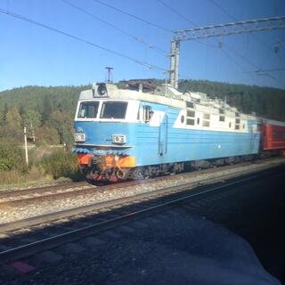 A pale blue electric locomotive.