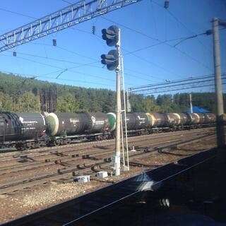A long line of cylindrical wagons.