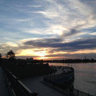 People stroll next to the Angara River.