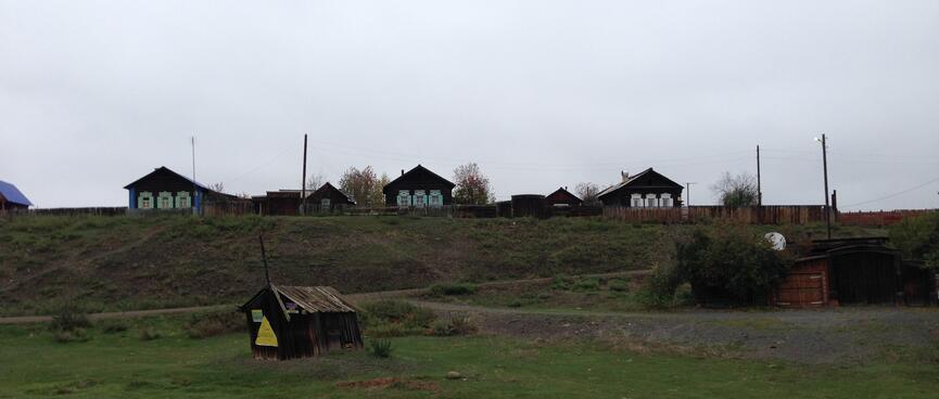 Patterned shutters frame windows on Russian houses in Maloye Goloustnoye.