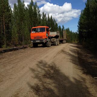 A large truck is parked on the side of the road.