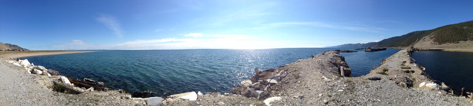 The shoreline of shingle, rocks, wire and breakwaters.