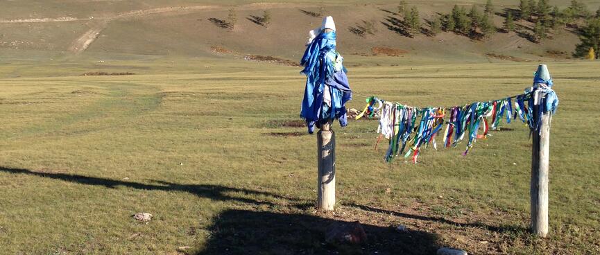 Fabric strips flutter in the afternoon breeze.