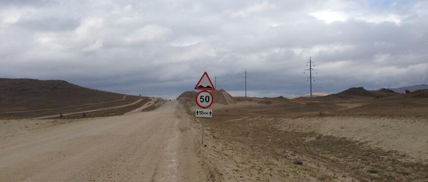 A road sign indicates speed humps.