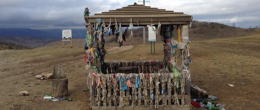 Ribbons hanging from all corners of a small shelter.