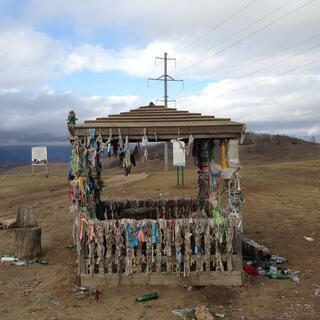 Ribbons hanging from all corners of a small shelter.