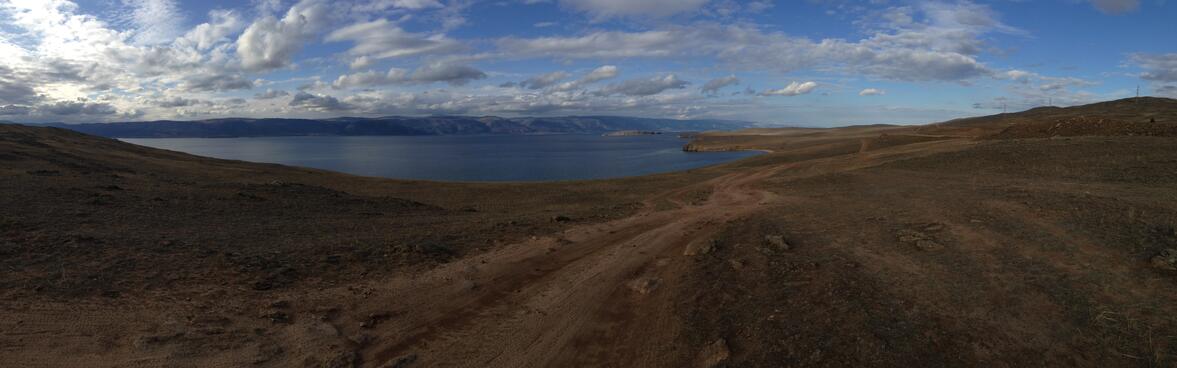 Looking down over green hills to the blue lake.