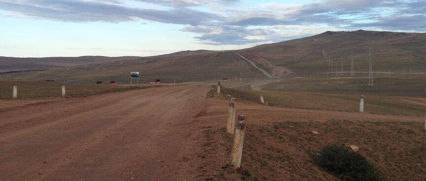 A long road climbs in the distance.