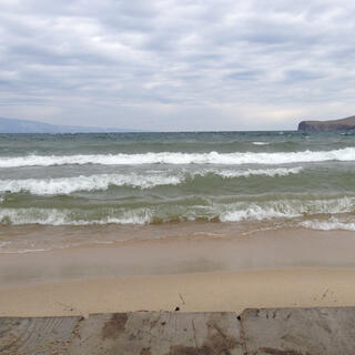 Waves break on the sandbar.
