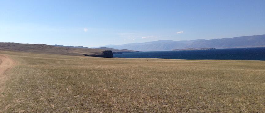 Steppes, cliffs, and the lake below.