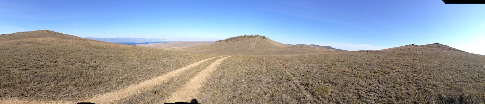 Hills flank the hilltop trail.