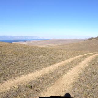 Hills flank the hilltop trail.