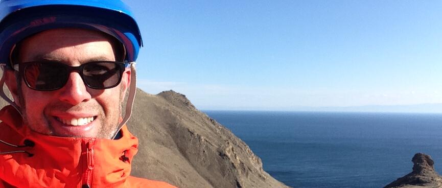 Smiling in my jacket and helmet.