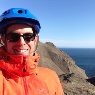 Smiling in my jacket and helmet.