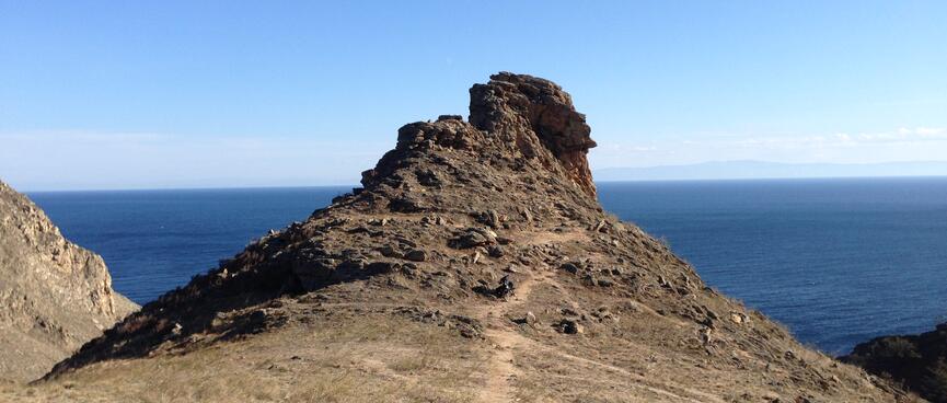At the crag, the steep track disappears up a rocky path.