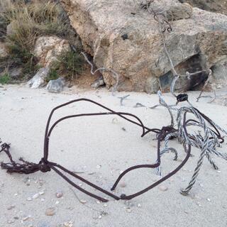 Wire lies in the sand.