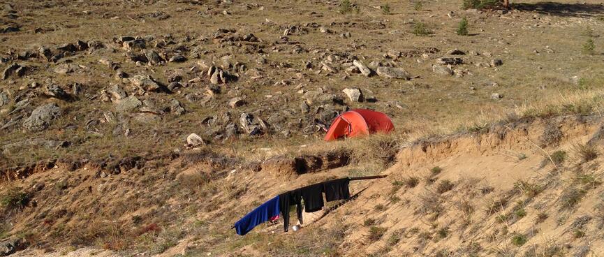 My riding gear hangs over a metal outfall pipe.