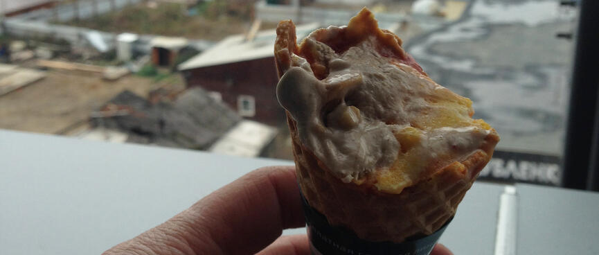 A city view and a half eaten ice-cream.