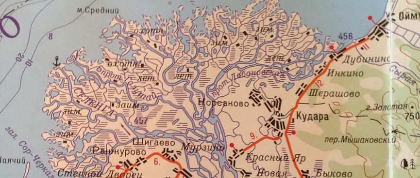 A braided river splinters the shoreline on a paper map.