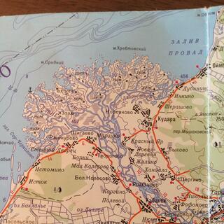 A braided river splinters the shoreline on a paper map.