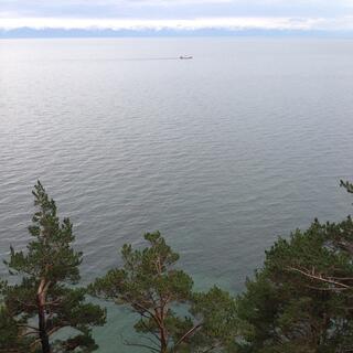 A longer boat leaves a dark trail.