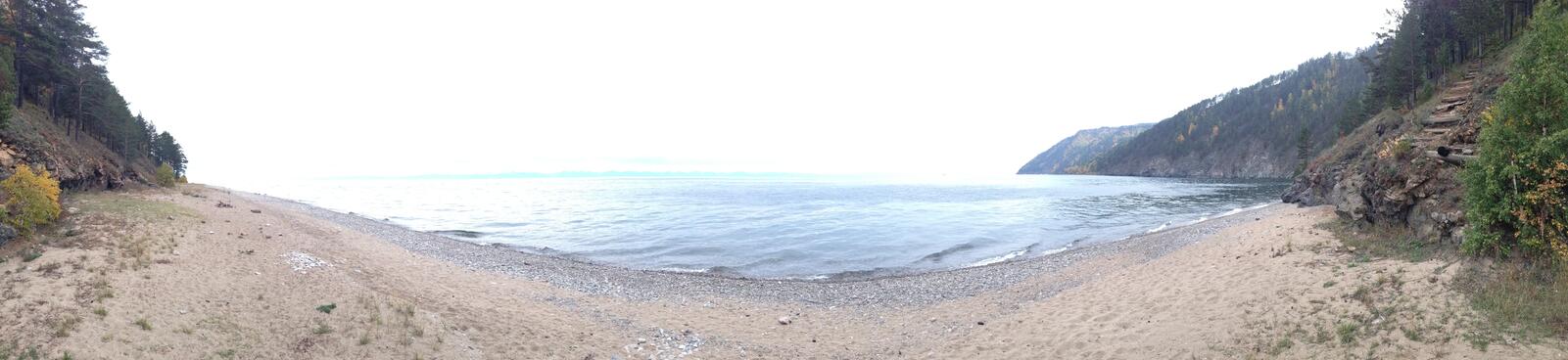 A panorama of the sandy shoreline.