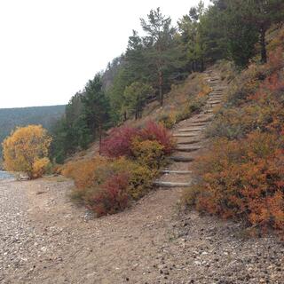 A staircase runs down to the beach.