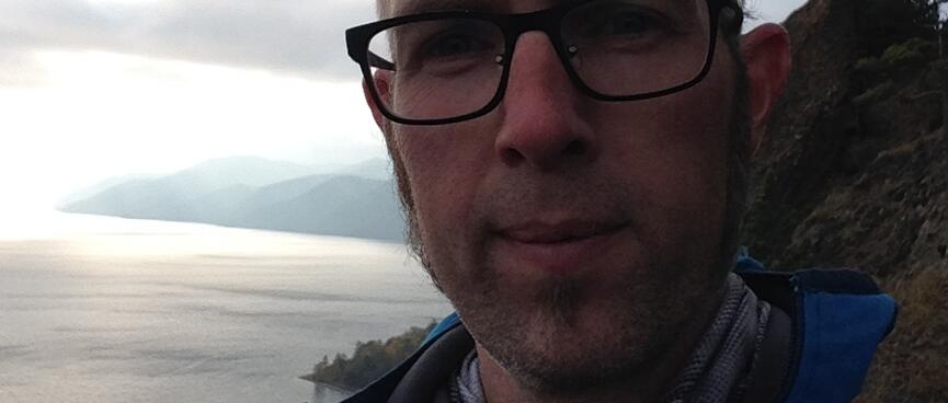 I smile after conquering the steep ascent.