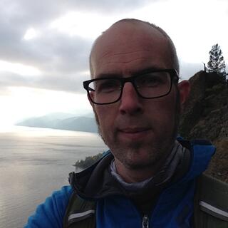I smile after conquering the steep ascent.