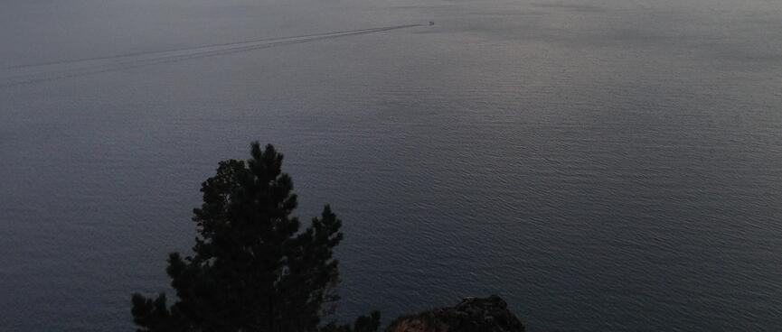 Rocky outcrops and the lake beyond.