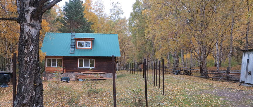 A house with a pitched blue roof.