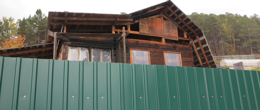 Rough wooden scaffolding on an unfinished house.