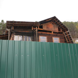 Rough wooden scaffolding on an unfinished house.