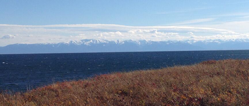 Wild grass and sculpted peaks.