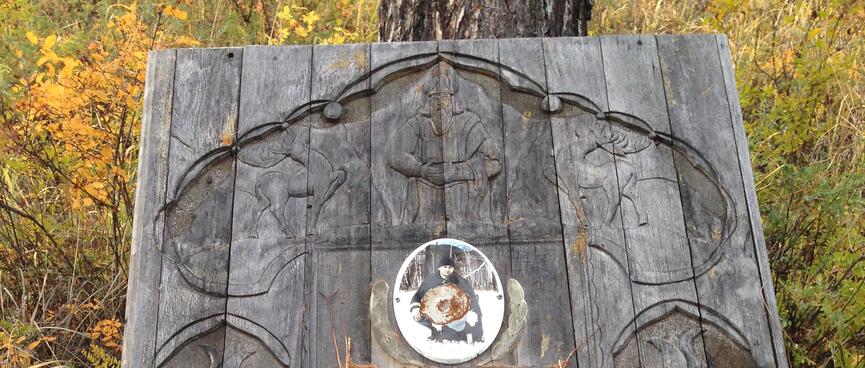 Carved headstone.