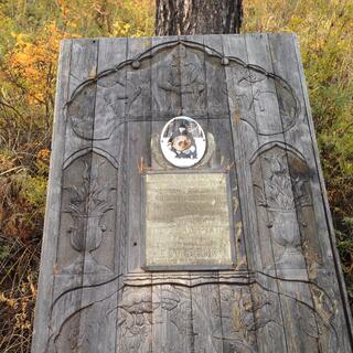 Carved headstone.