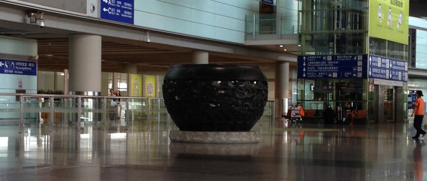 A large pot sculpture inside the terminal.