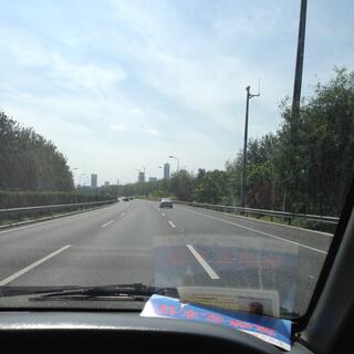 Driving down the three lane expressway towards Beijing city.