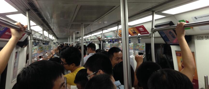 Looking down on Chinese people while riding the subway.