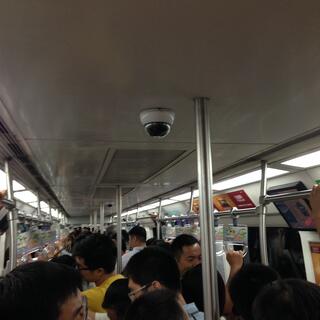 Looking down on Chinese people while riding the subway.