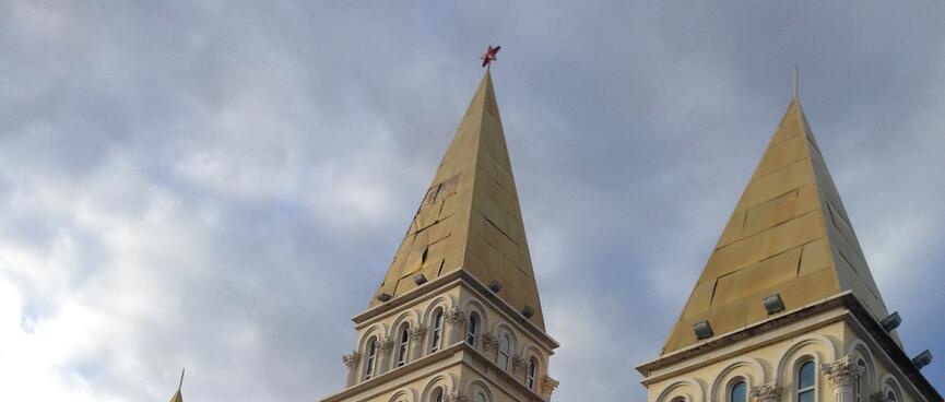 Steeples adorn the roof of the local bank.