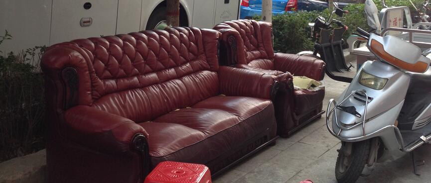 The footpath is filled with motorcycles and Shabby Chic leather couches.