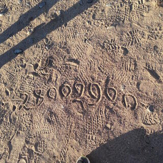 Numbers written in the sand.