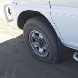 The flat front left tyre of our van.